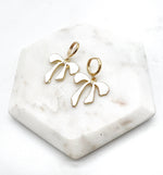 White Bow Huggie Hoop Earrings